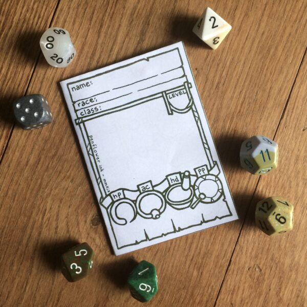 5E Monk Character Sheet Booklet surrounded by dice