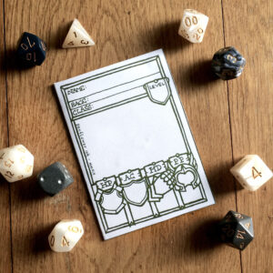 5E Paladin Character Sheet Booklet displayed with dice