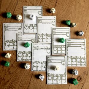5E Race Character Sheet Booklets all displayed and surrounded by dice.