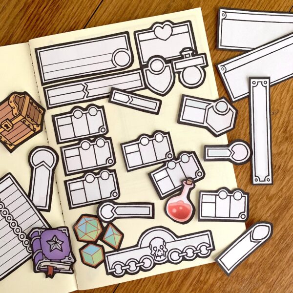 printable modular character sheet assets, arranged on a blank notebook.