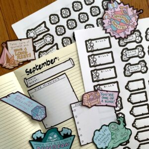 RPG-Themed Monthly Planner bits displayed on a lined notebook