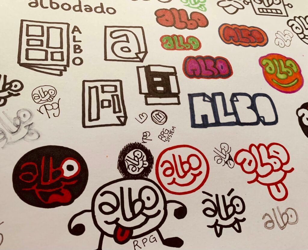 Photo of a page full of sharpie pen doodles, charting the evolution of the 'Albo' RPG logo.