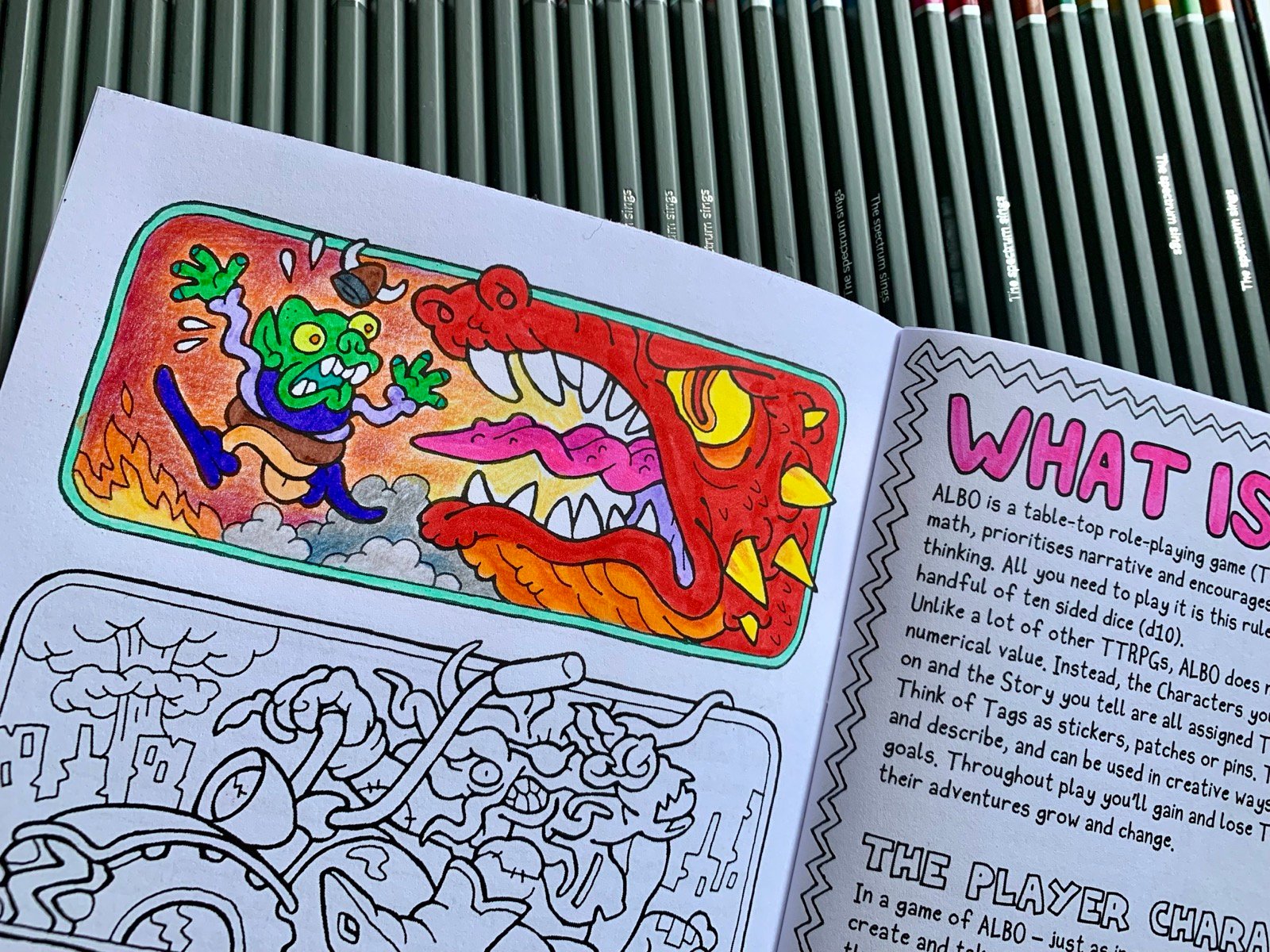 ALBO zine page, partially coloured in.