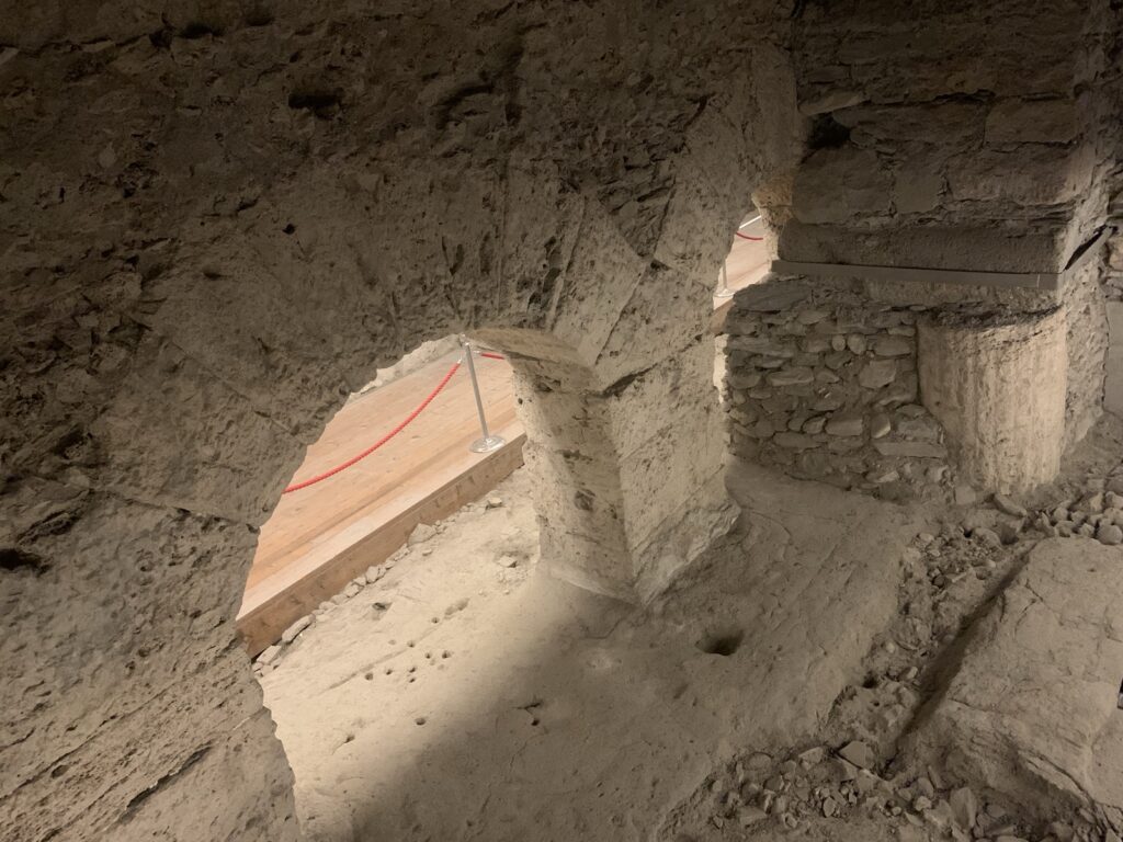 Criptoportico Forense - view of the portico archways from a raised platform.